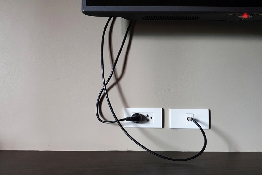 A tv and a wall outlet